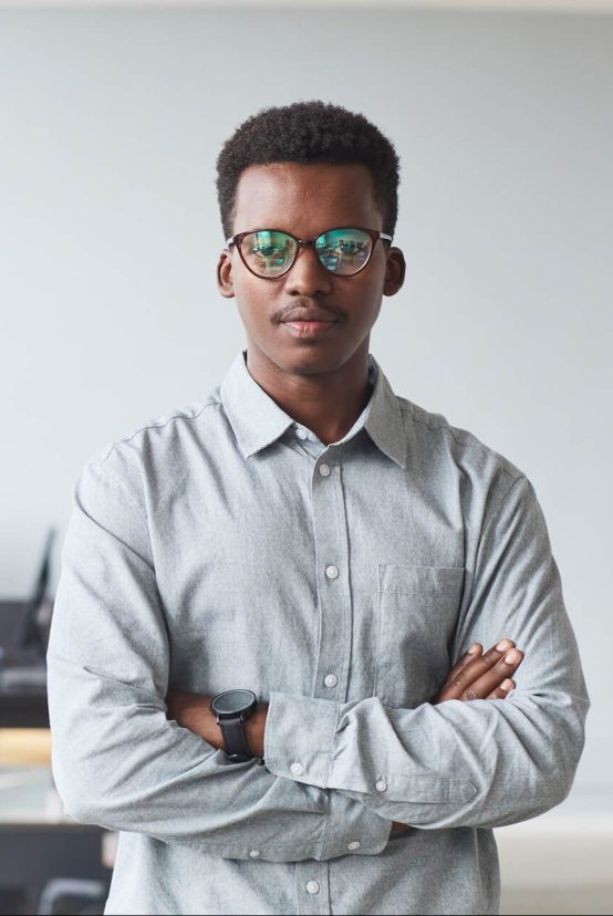 portrait-of-african-american-man-standing-in-offic-2022-01-19-00-08-58-utc-e1658640095264.jpg